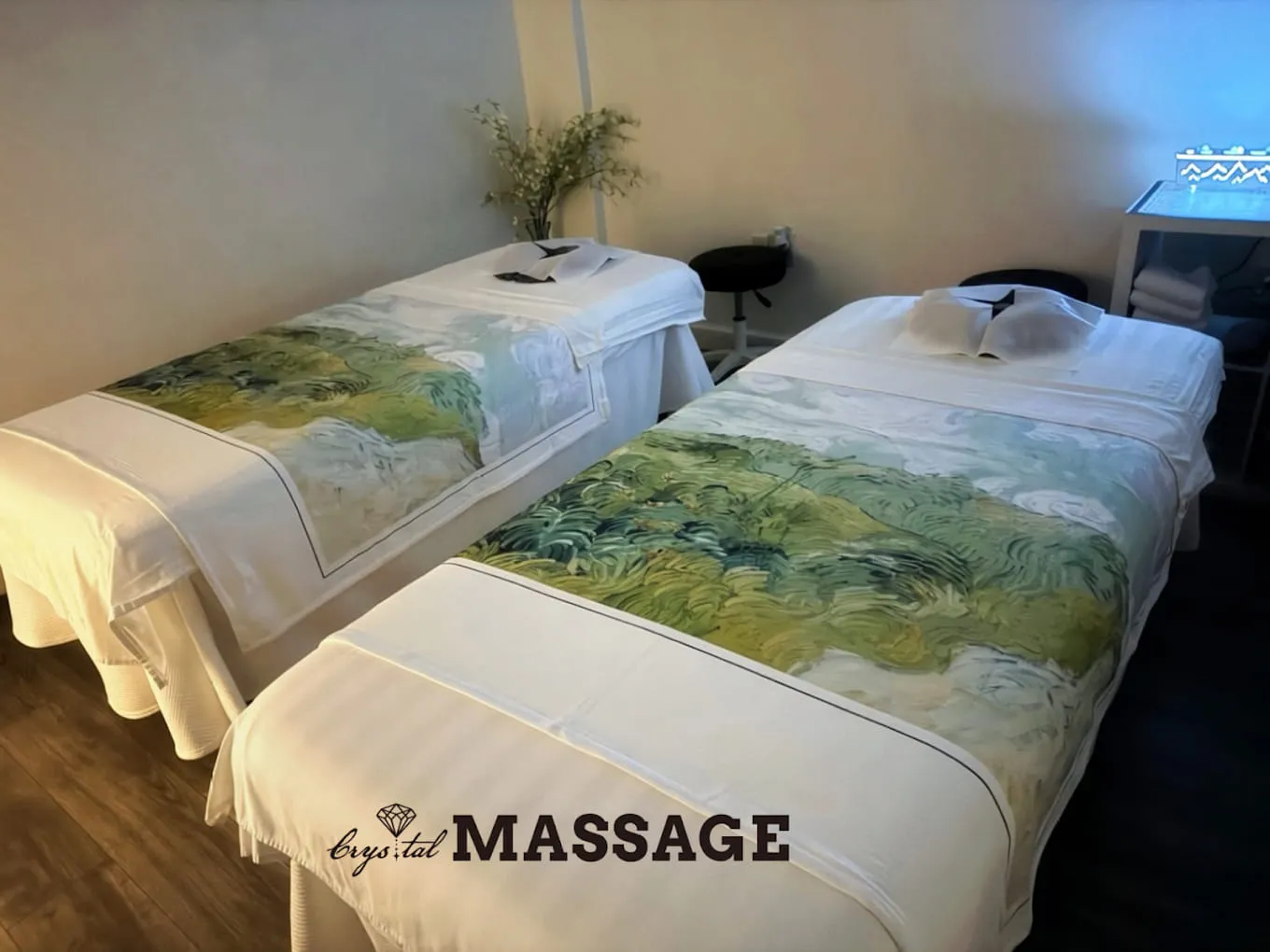Two massage tables side by side in the couples room at Crystal Massage